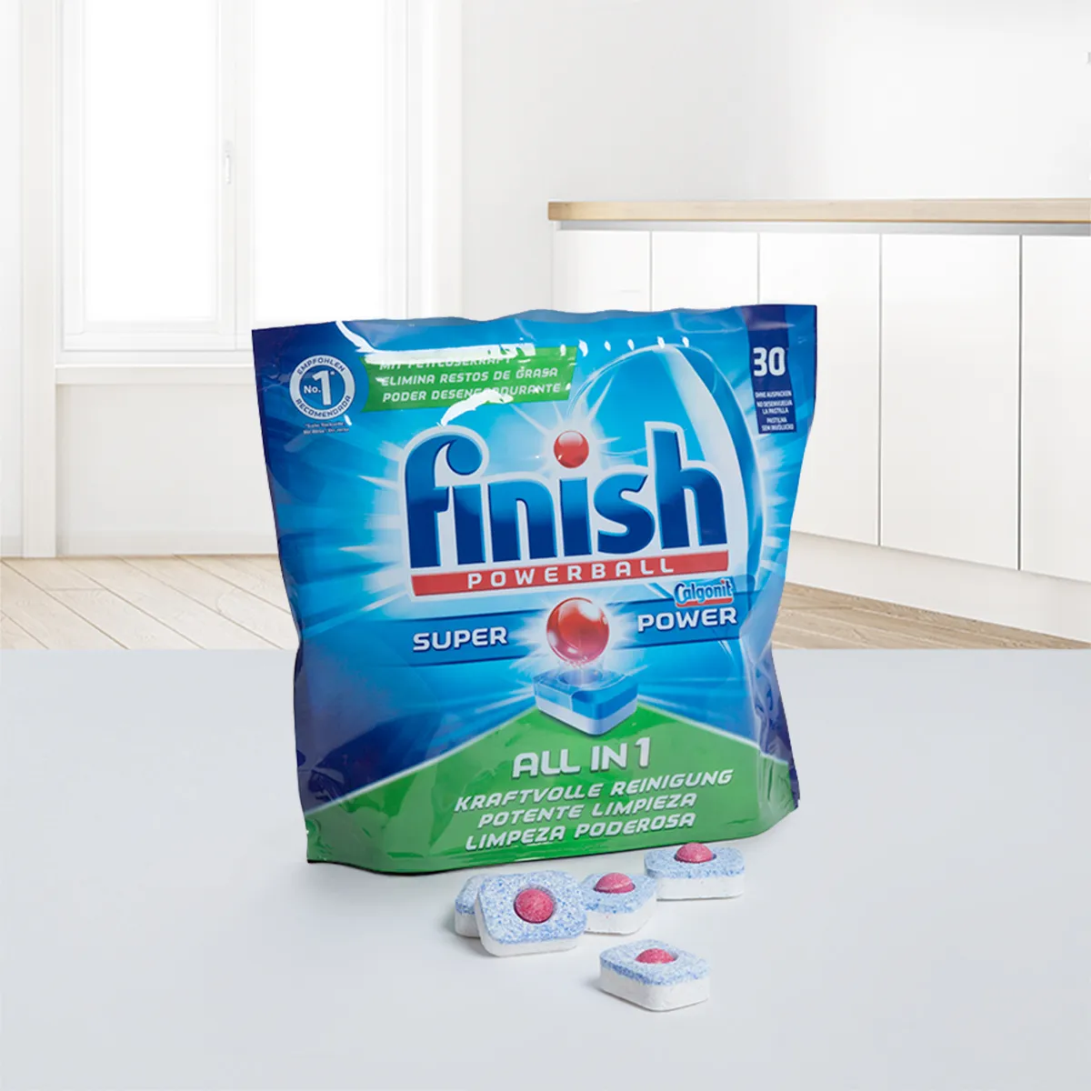 Finish Powerball dishwasher tablets pack on a kitchen surface, showing 4 individual tablets.