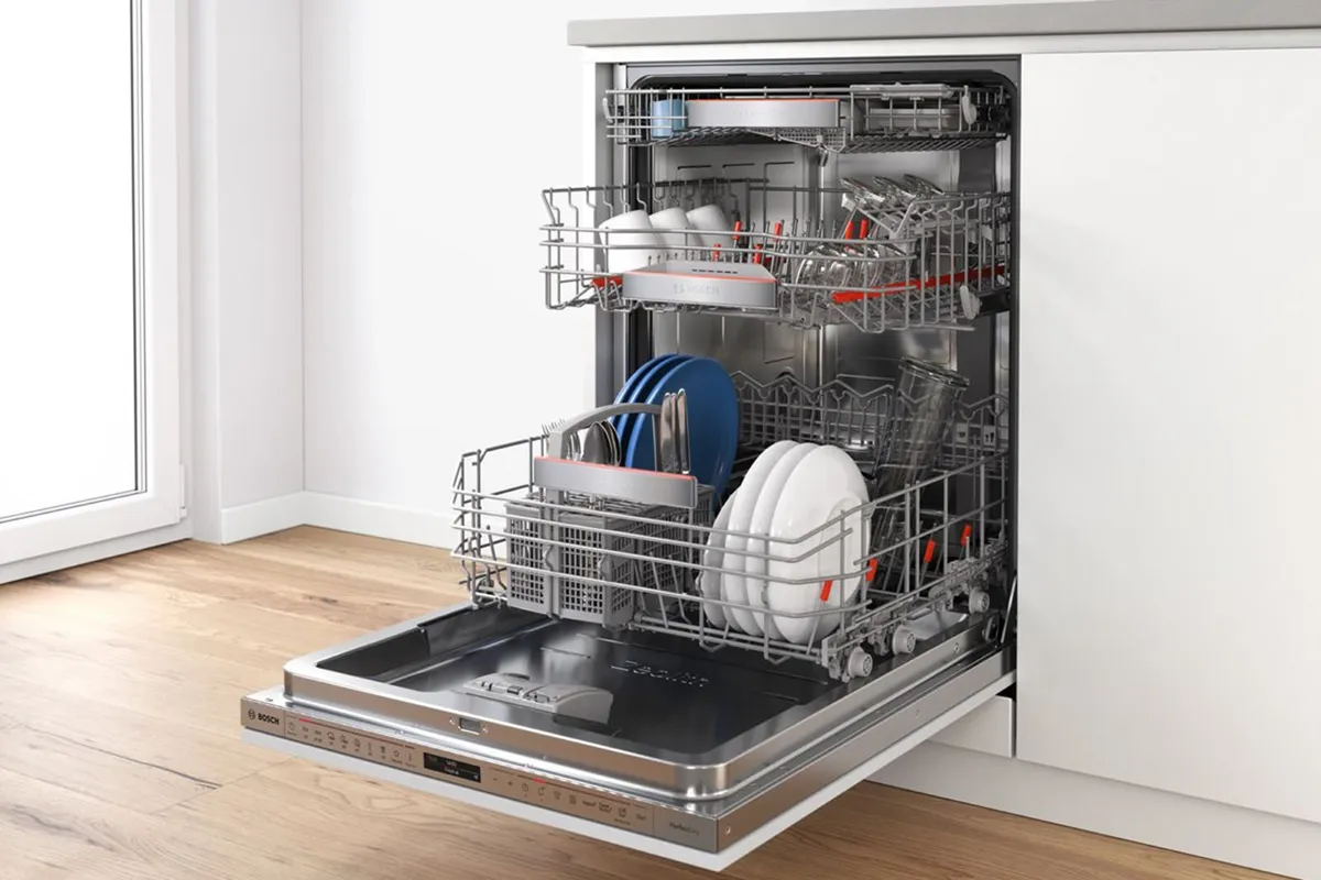 Fully-integrated Bosch dishwasher that is not filled to capacity – perfect for the half load setting.