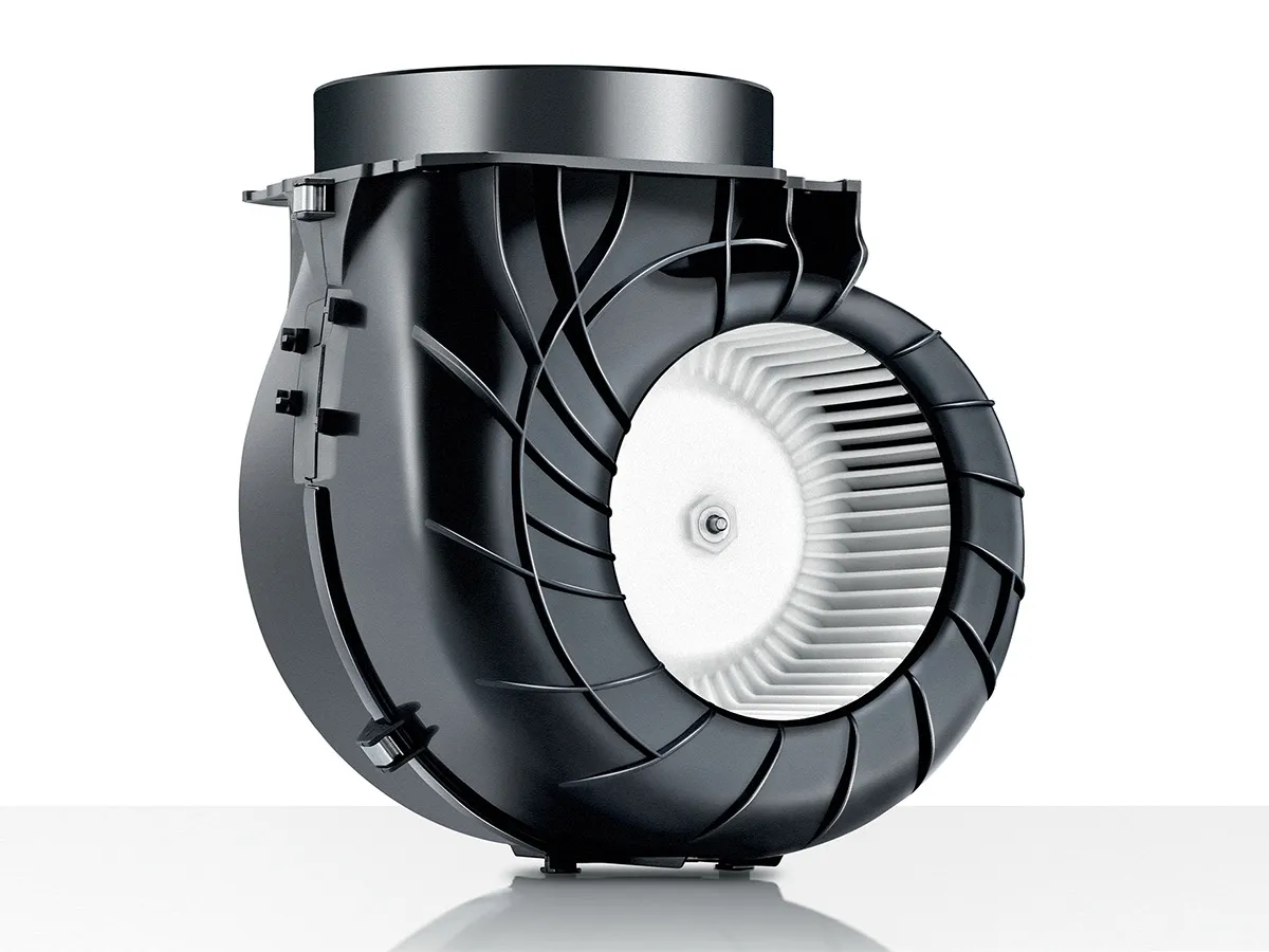 Automotive cooling fan with black plastic housing and white impeller blades.