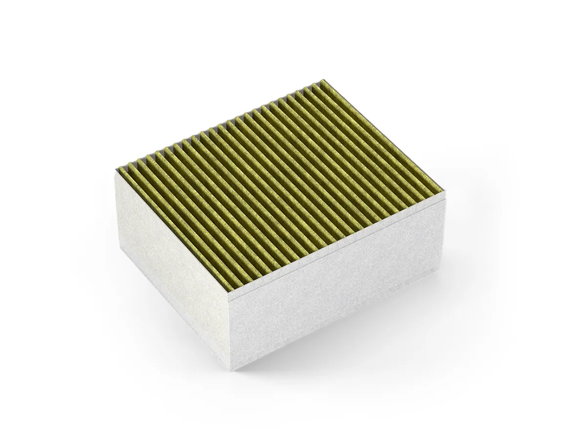 Rectangular white block with parallel green lines, resembling an air filter or heat sink.