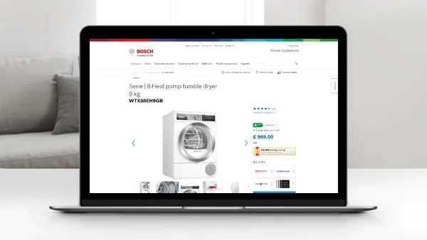 Laptoplar görüntüleniyor Bir beyaz tumble kurutucu cihazının görüntüsü ile Bosch web sitesi.