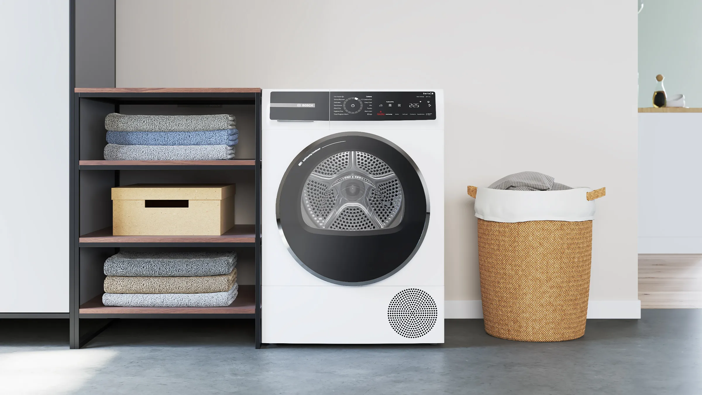 En torktumlare från Bosch bredvid en öppen garderob.