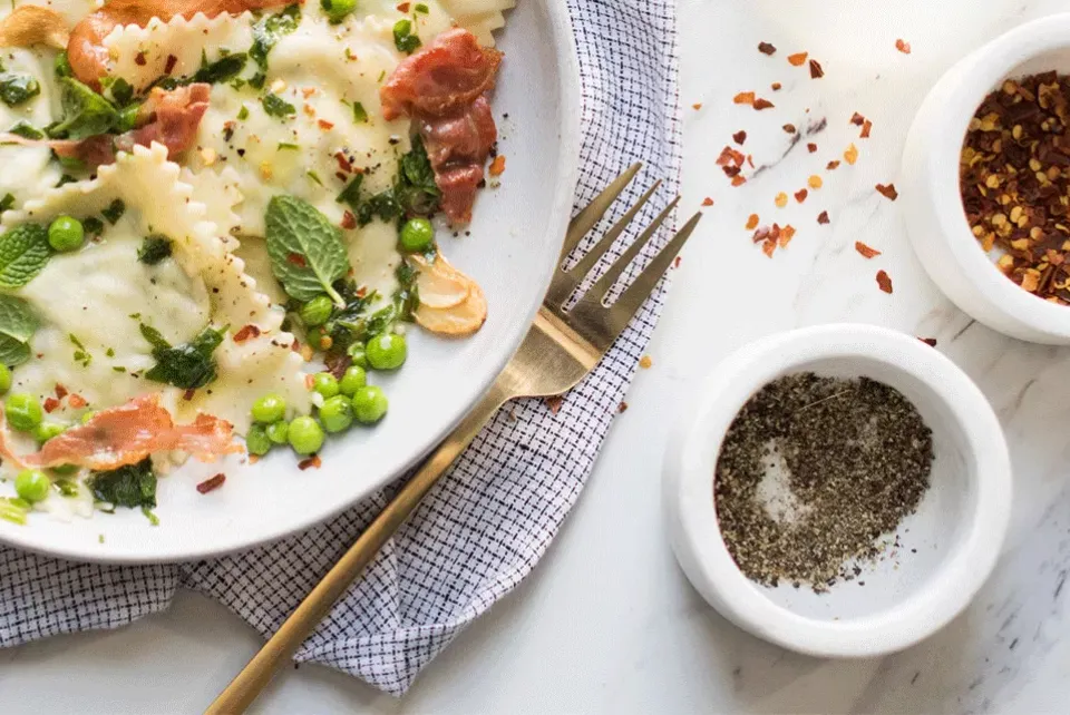 Plate of food and seasoning on the side