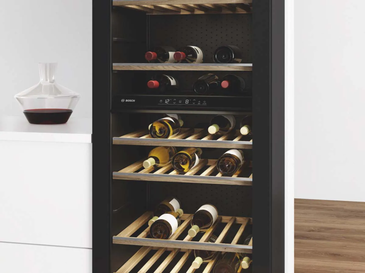 Wine cooler built into white cabinet