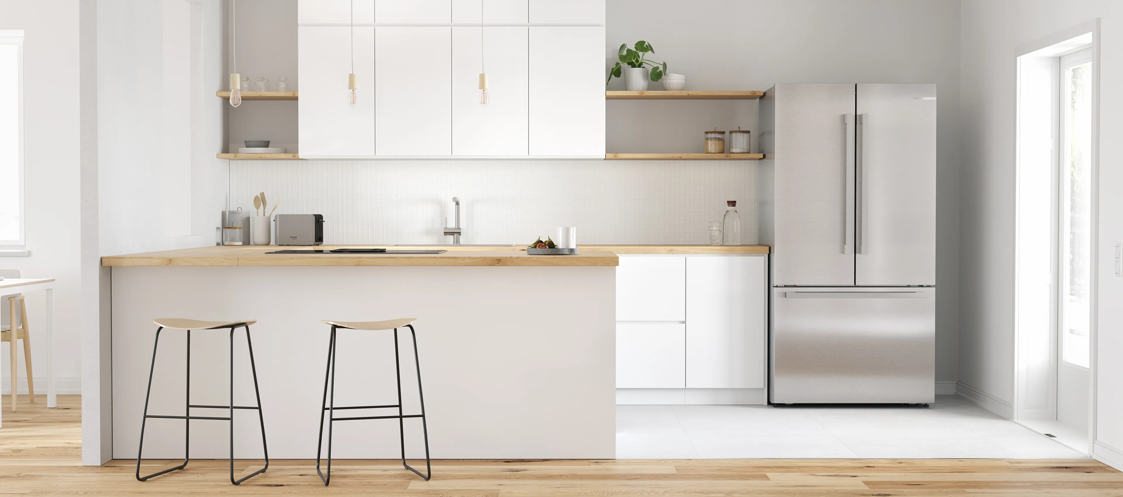 A spacious kitchen showcases a modern refrigerator filled with organized food and drinks, surrounded by plants.