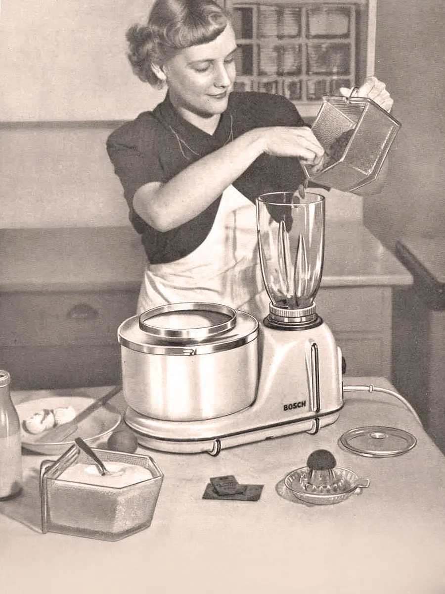 Vintage image of a woman blending ingredients using a classic Bosch retro-style mixer and blender attachment.