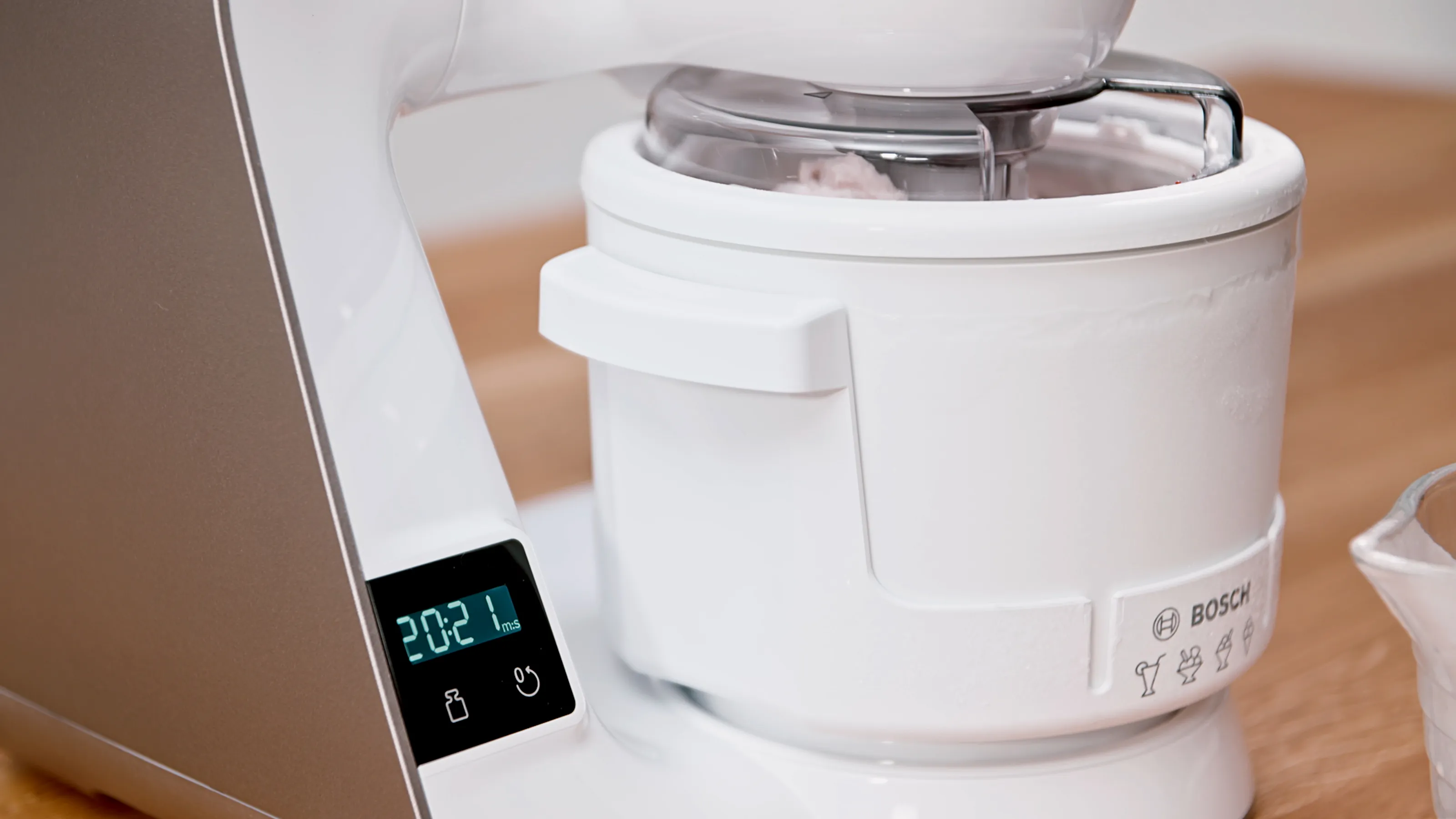 White kitchen appliance with digital display showing temperature.