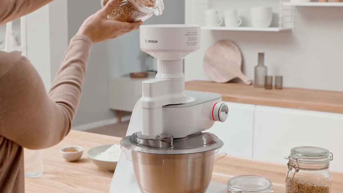 Kitchen appliance, stand mixer, food preparation, cooking, baking, kitchen counter, utensils.