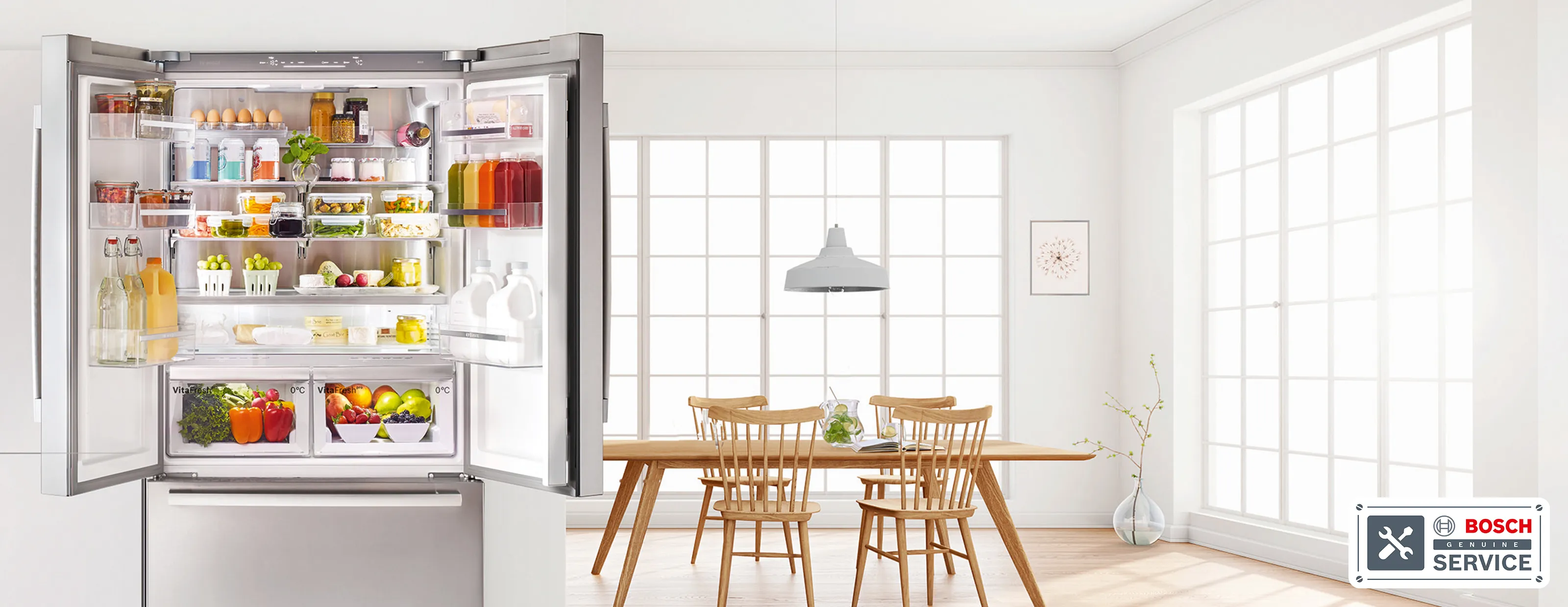 Open doors on a French door fridge freezer showing a full fridge with food in a modern home