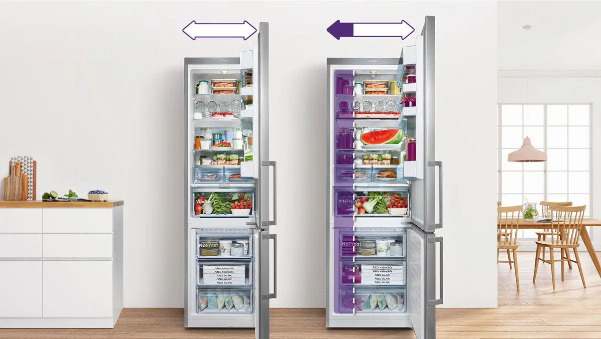ثلاجة تجميد Bosch XXL NoFrost، تظهر مع فتح بابها لتكشف عن مساحة داخلية واسعة، بجوار طراز مماثل مع أرفف ملونة باللون الأرجواني، مما يؤكد على سعتها الكبيرة.