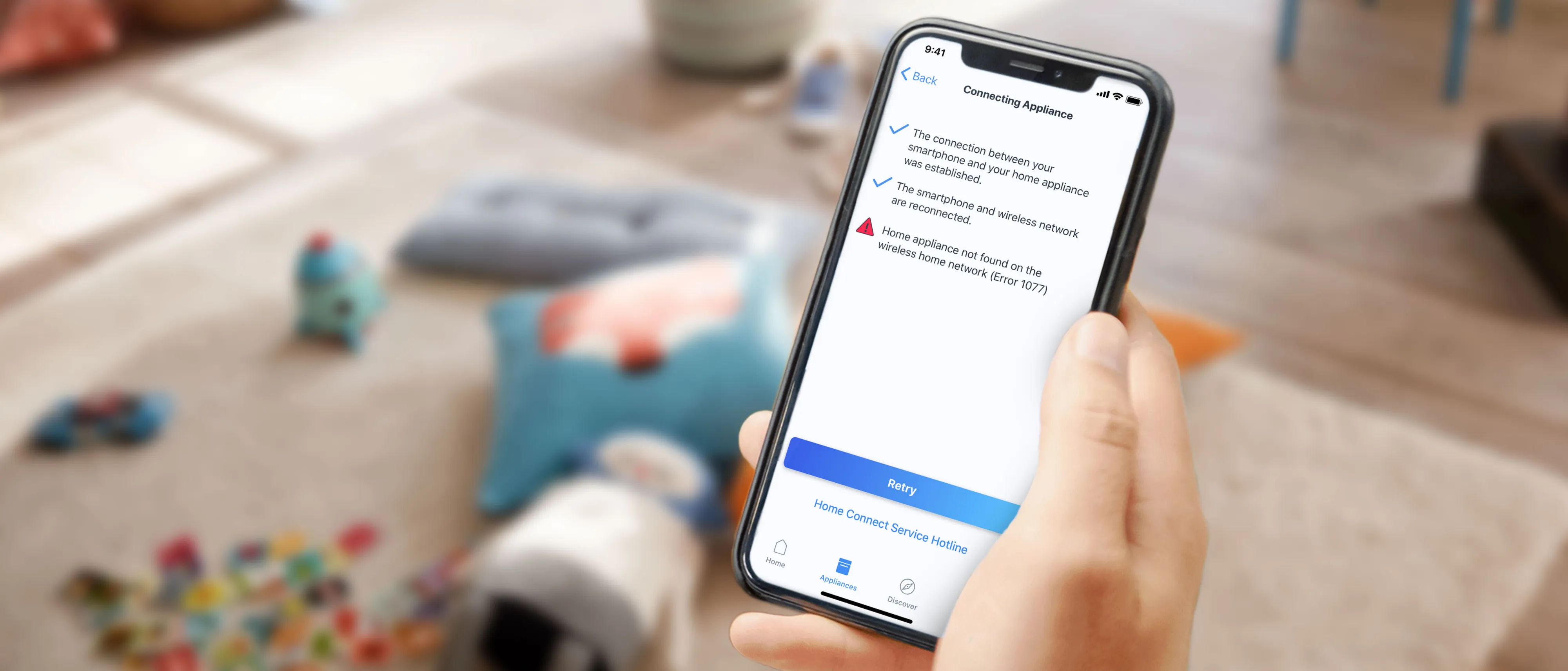Hand holding a smartphone showing a Home Connect automation app in a living room setting.