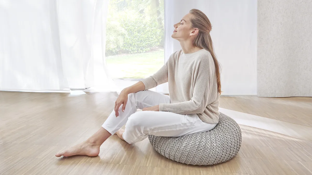 Woman sitting.