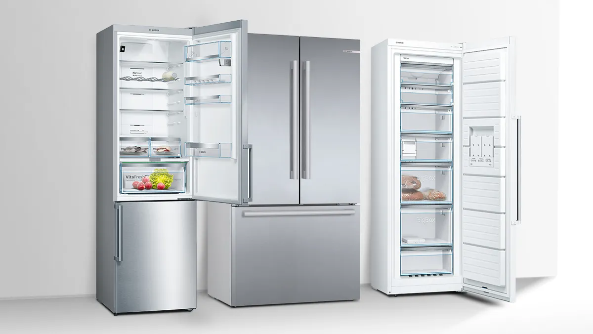 A modern refrigerator with a stainless steel finish, showcasing neatly organized food items and fresh produce inside.