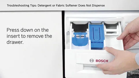 Hands pressing down on a drawer insert to remove it from a Bosch appliance.