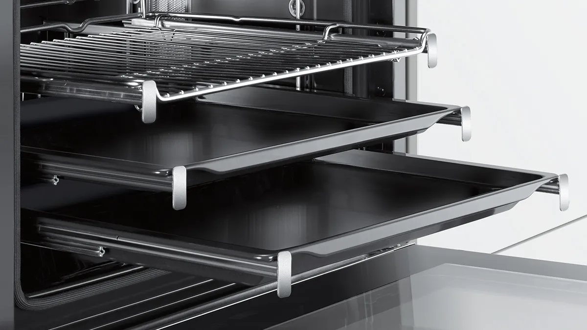 Open oven with telescopic rails.