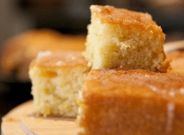 Slice of lemon drizzle cake.