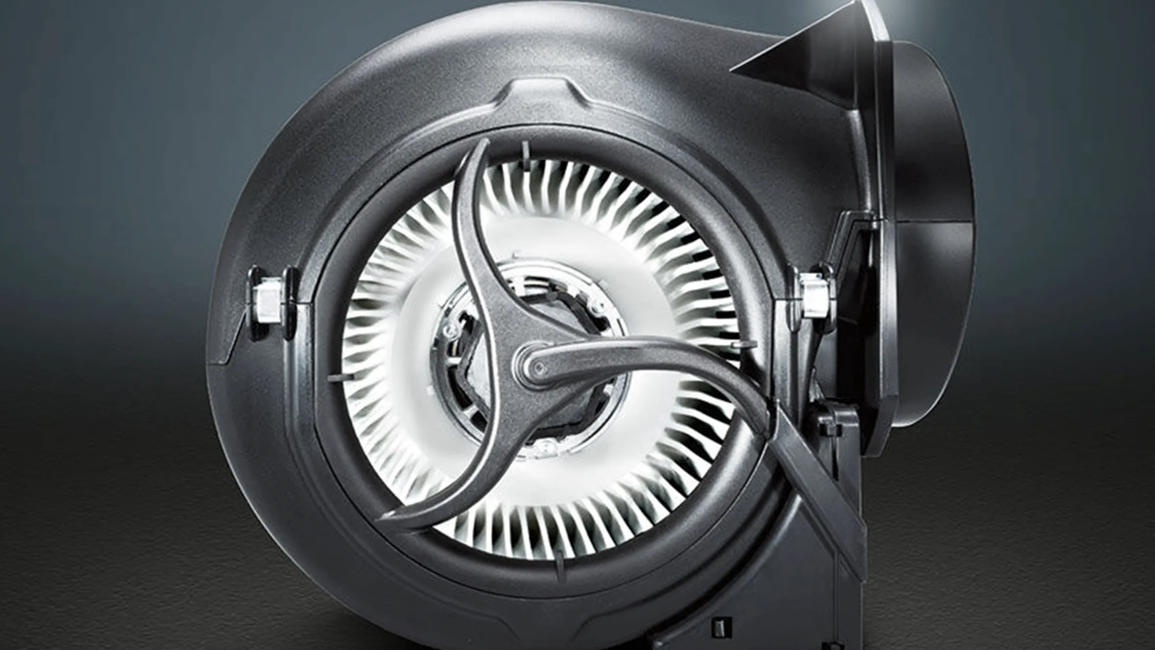 Close-up of a Siemens iQdrive motor, typically found in Siemens appliances like cooker hoods and washing machines, featuring its brushless design and fan blades