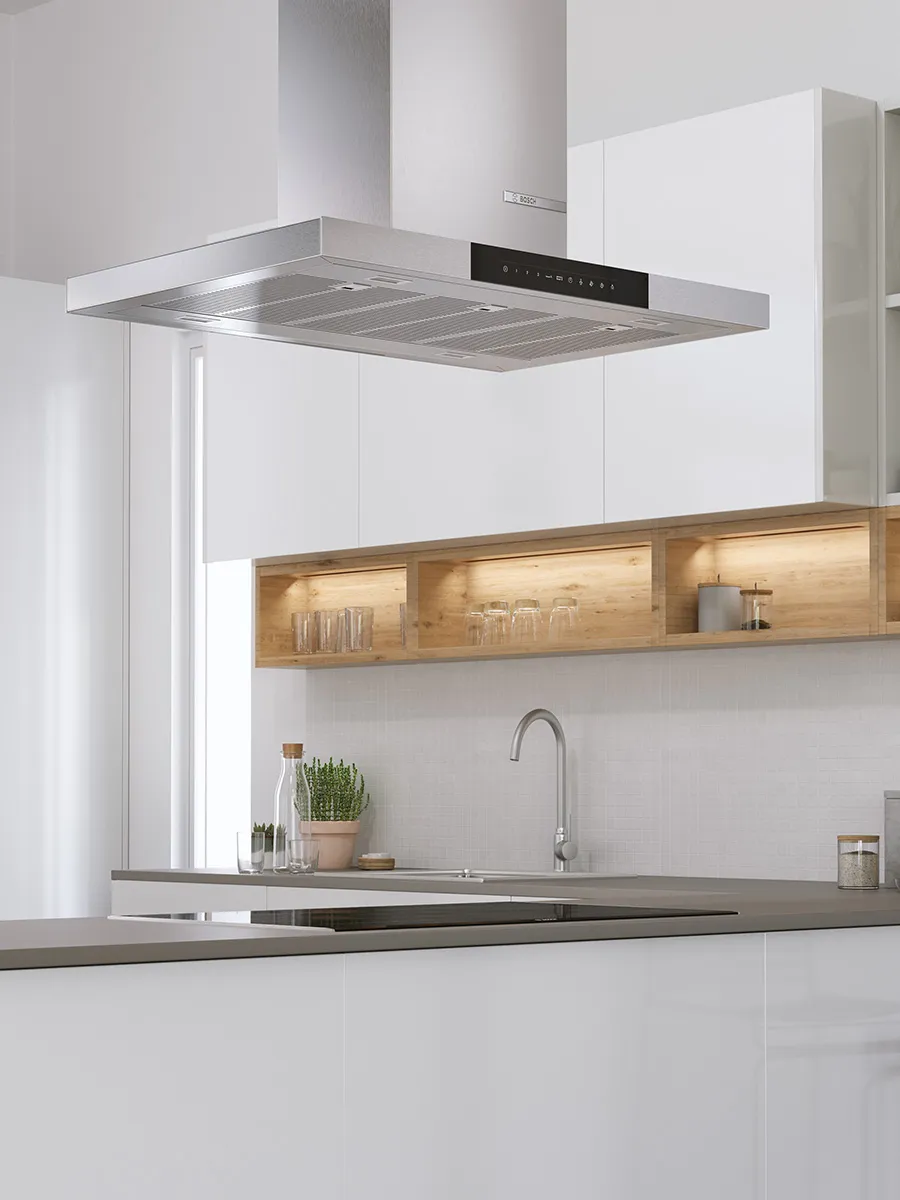 Modern kitchen featuring a wooden island, sleek stools, and minimalist decor.