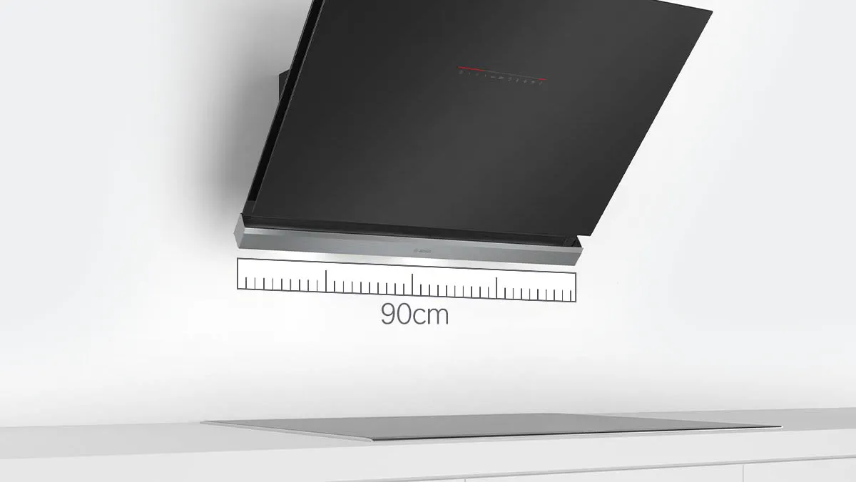 A black kitchen hood mounted above a cooktop, with a 90cm measuring scale displayed for reference.