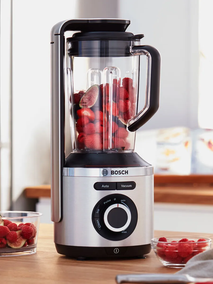 Bosch countertop blender jar filled with raspberries.