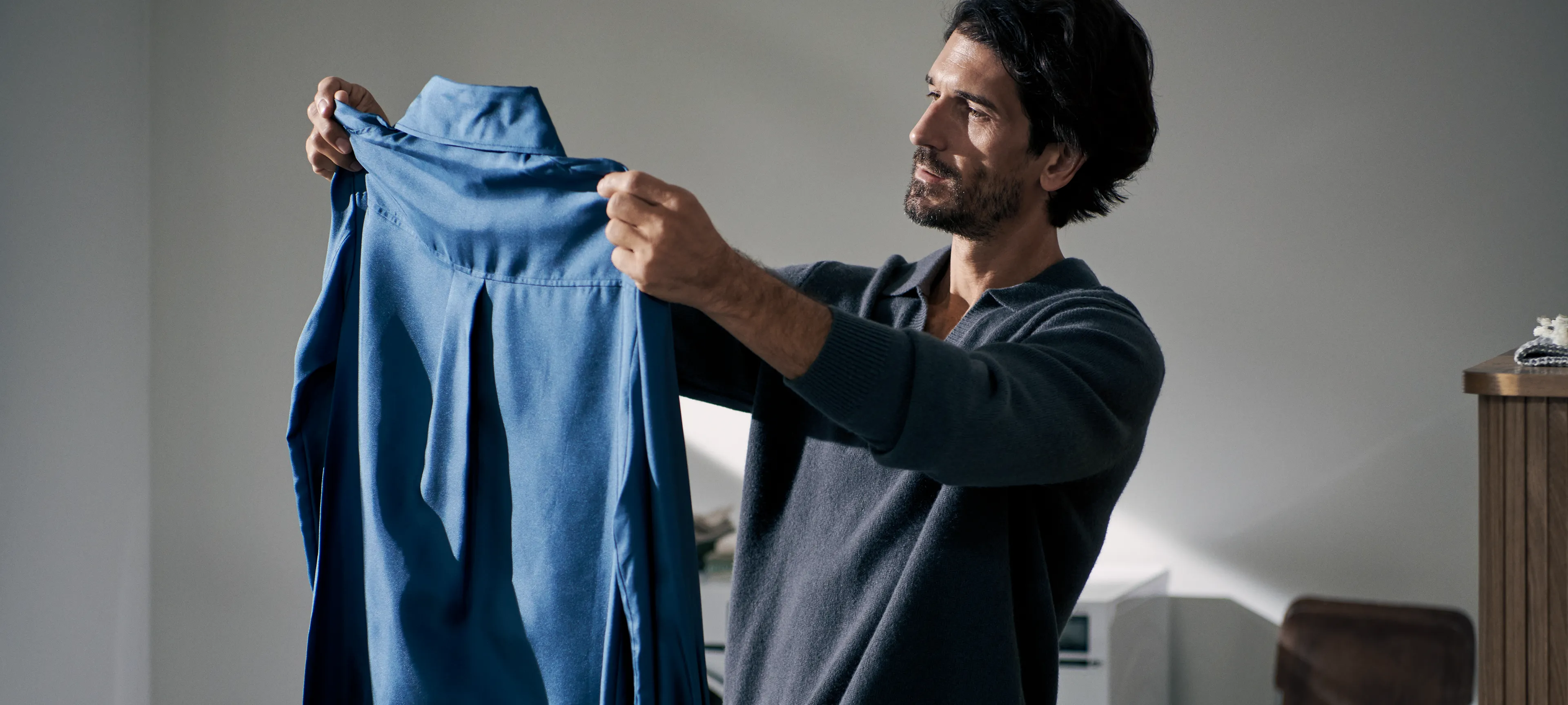 Siemens empowering folding laundry machine in a contemporary home laundry room