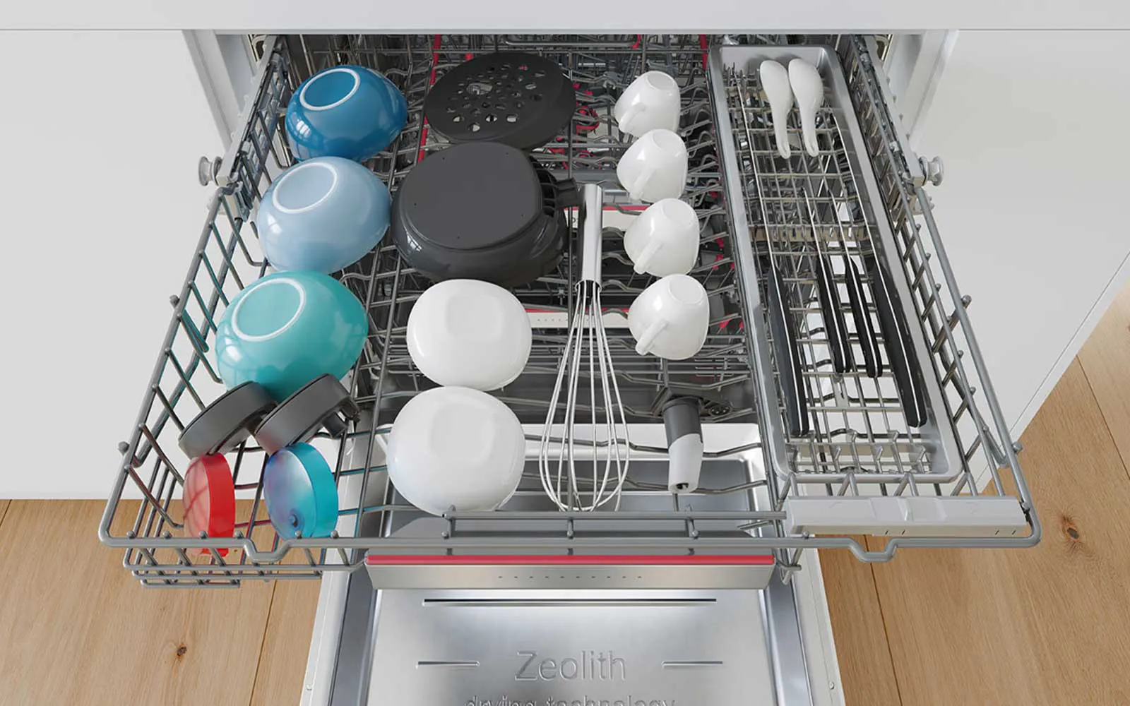 Intérieur du lave-vaisselle avec différents ustensiles de cuisine et des plats soigneusement disposés.