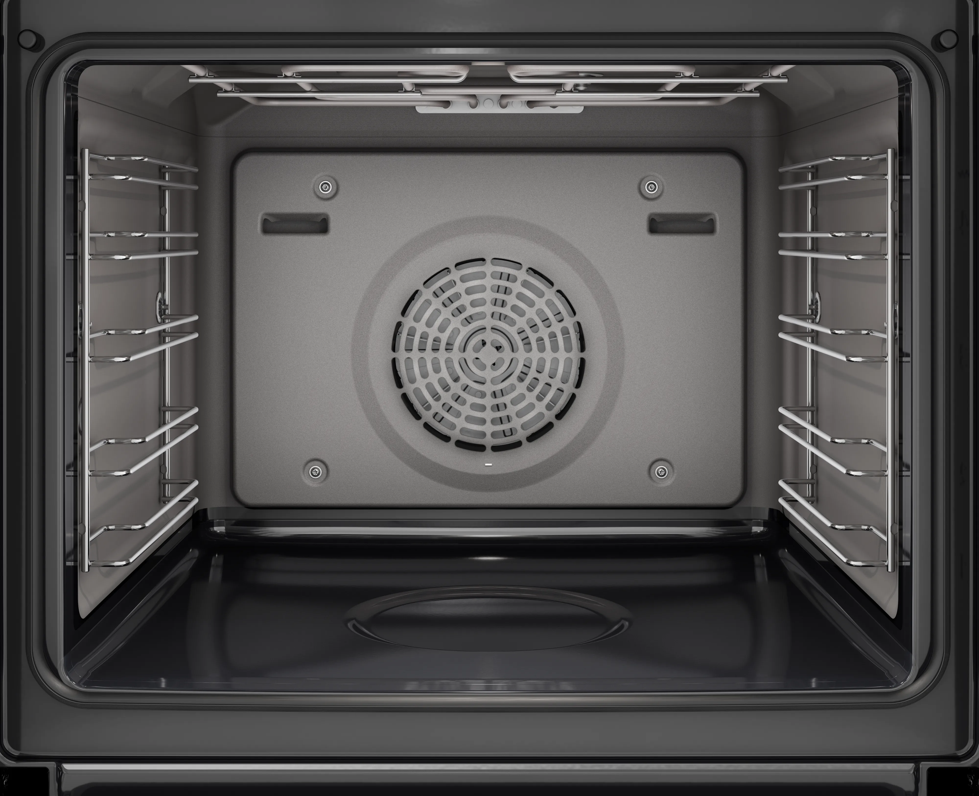 L'immagine mostra l'interno di un forno elettrico vuoto, dotato di griglie metalliche su entrambi i lati e di una ventola sulla parete di fondo.