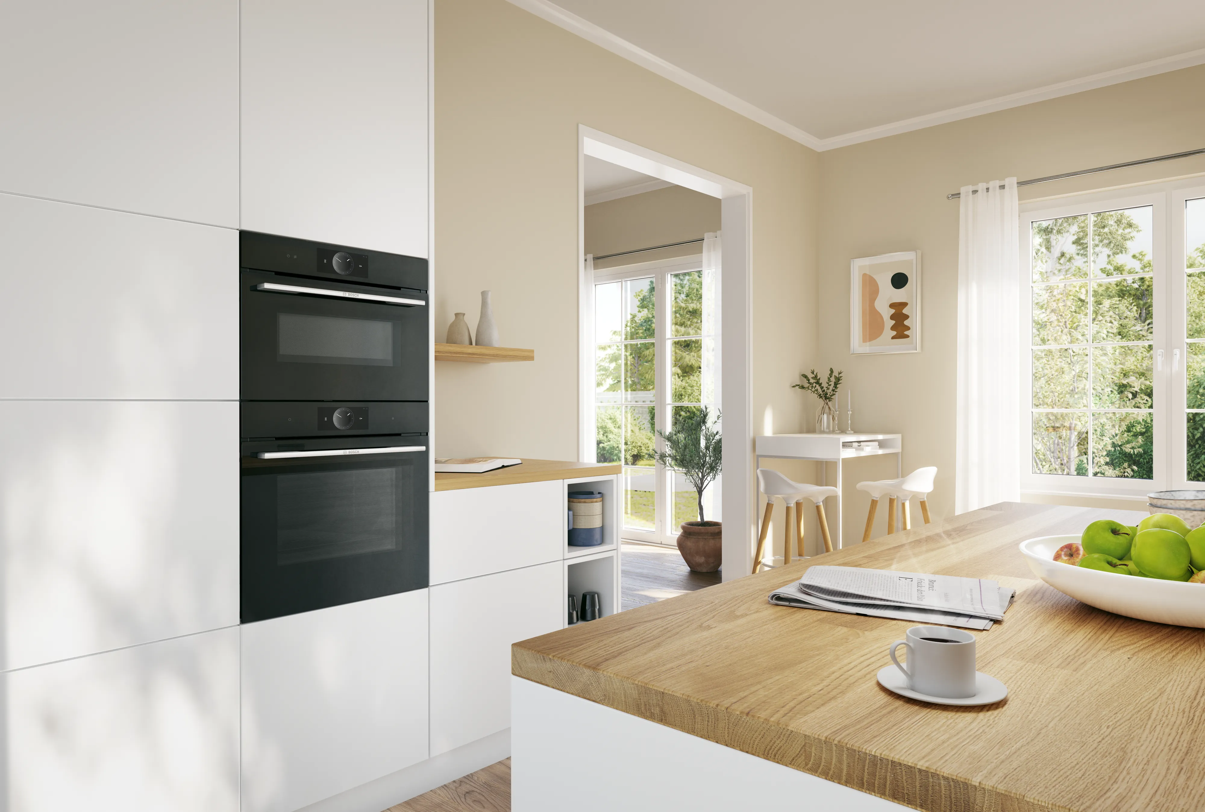 Forni da incasso neri integrati in una cucina luminosa dal design moderno, con mobili bianchi e dettagli in legno naturale.