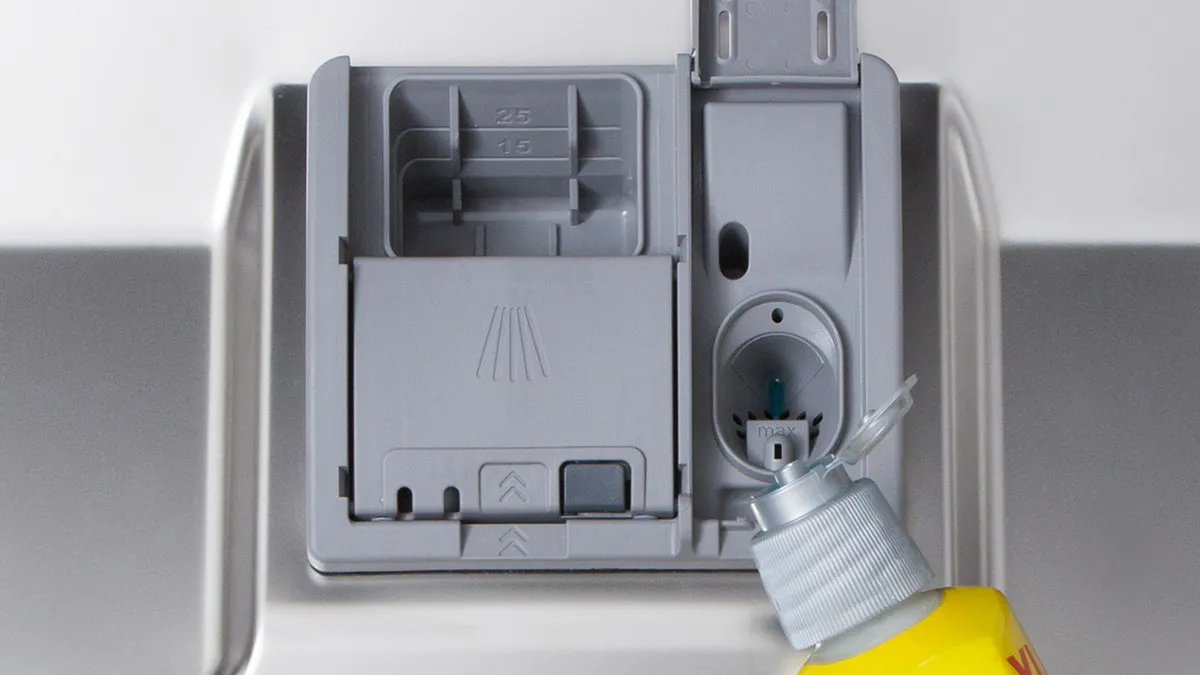 Household appliance, detergent dispenser, control panel, gray and yellow colors, close-up view.