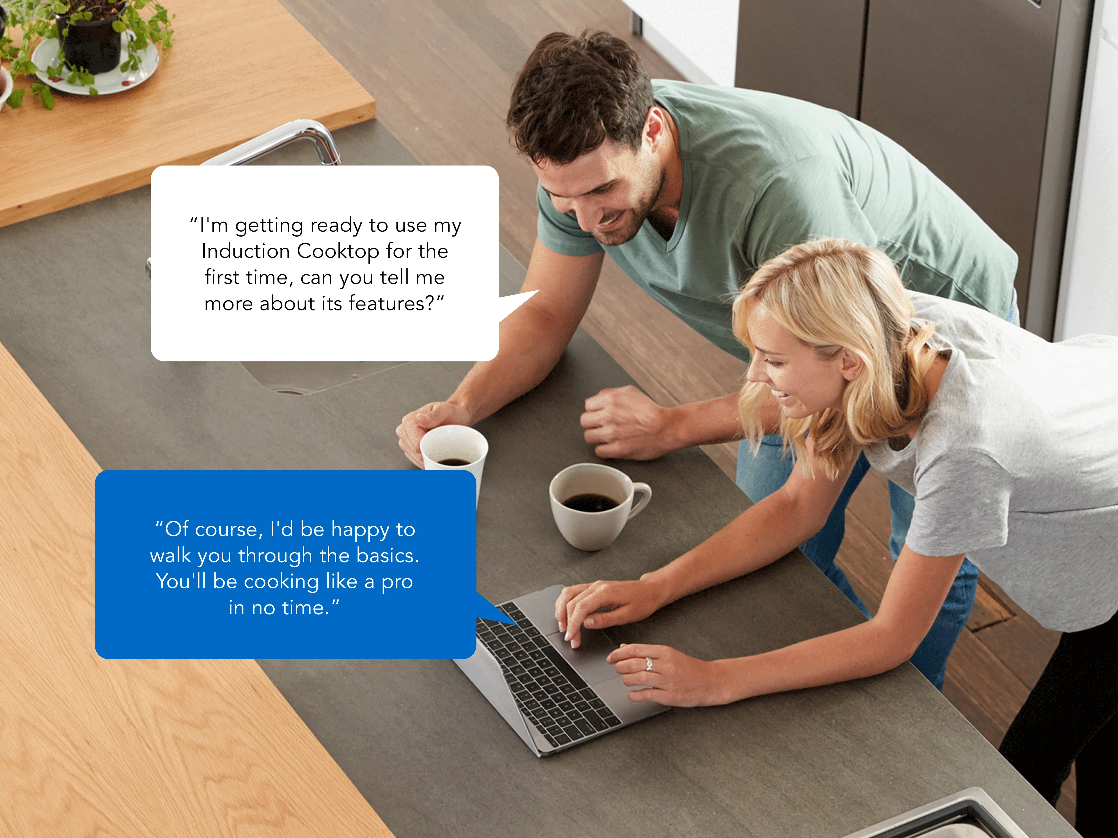 Two people in a kitchen discussing Bosch induction cooktop features over coffee and a laptop.