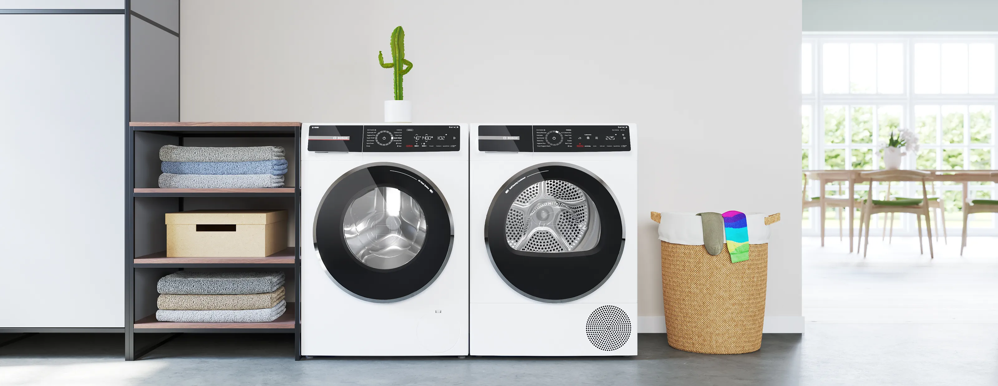 Bosch Series 8 washing machine with i-DOS stands next to a tumble dryer. A small cactus stands on top of it and gives a thumbs up.
