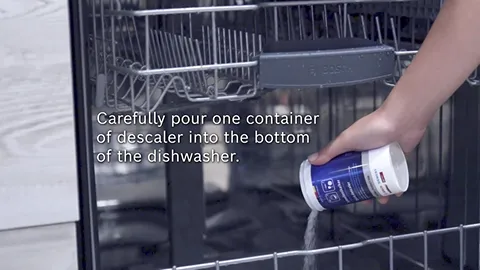 Bosch Dishwasher interior with descaler container, pouring instructions.