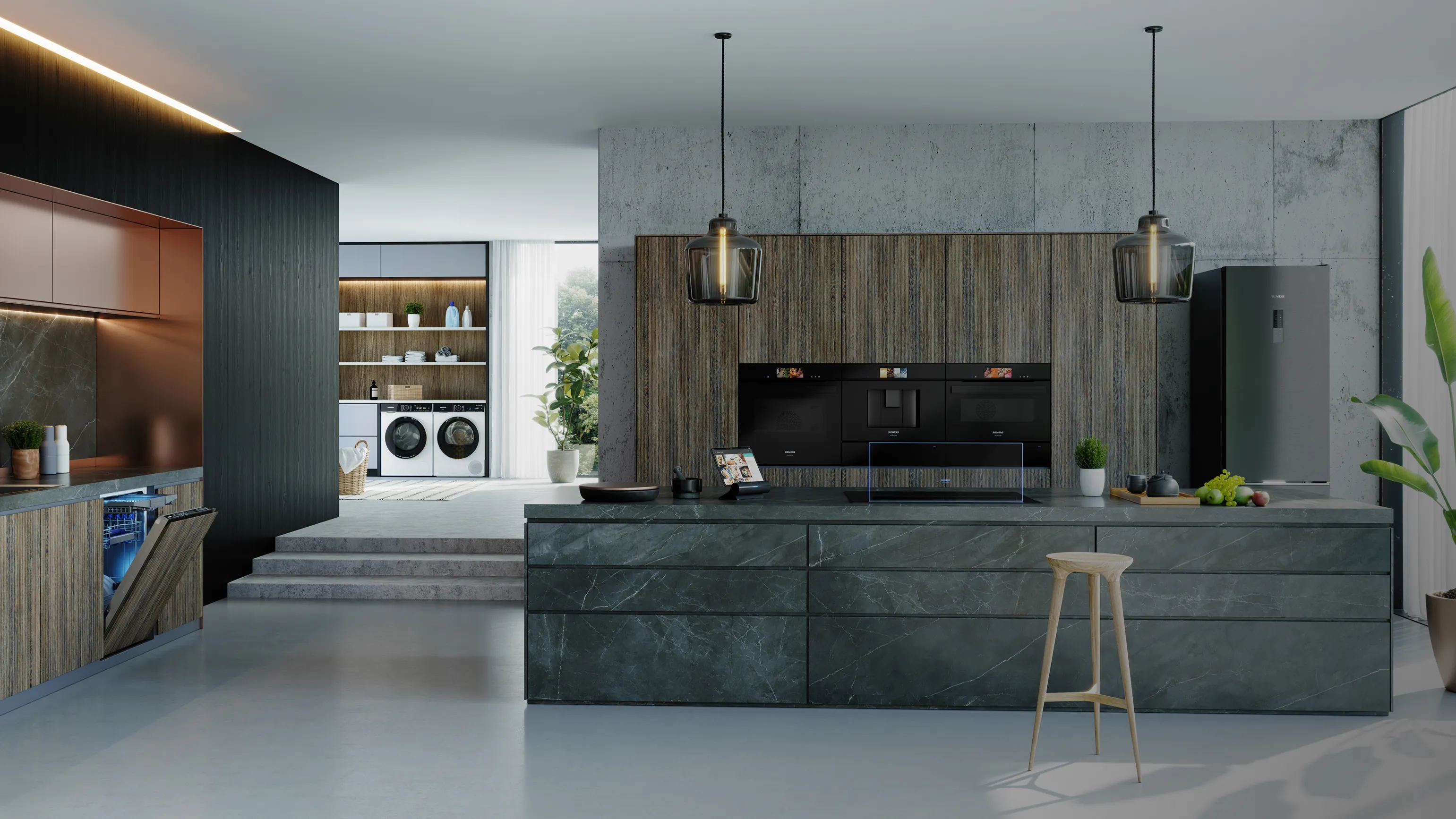 Cuisine moderne avec armoires en bois, comptoirs en marbre et éclairage pendentif.