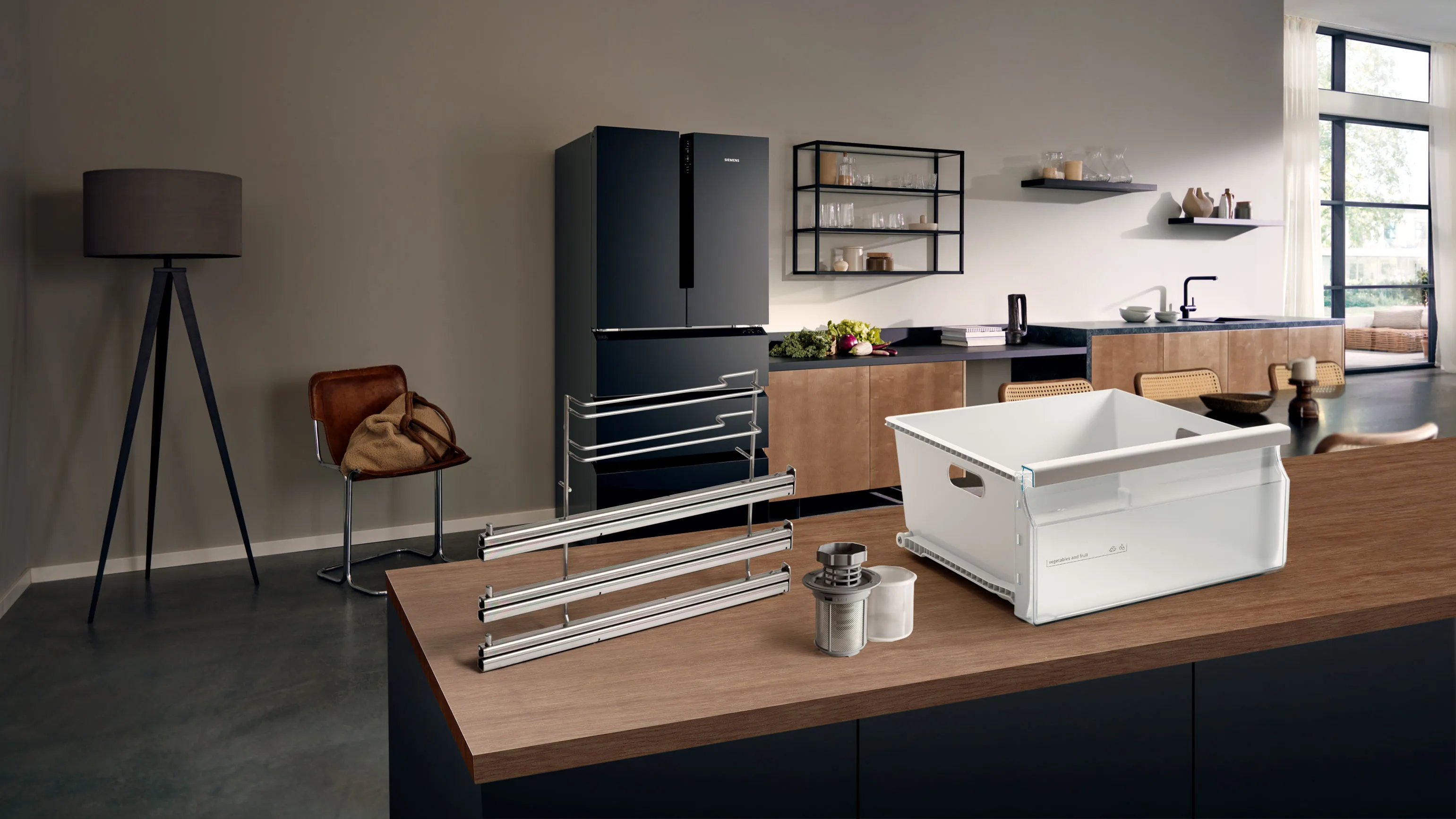 Kitchen island with spare appliance parts, white drawer bin and metal rails.