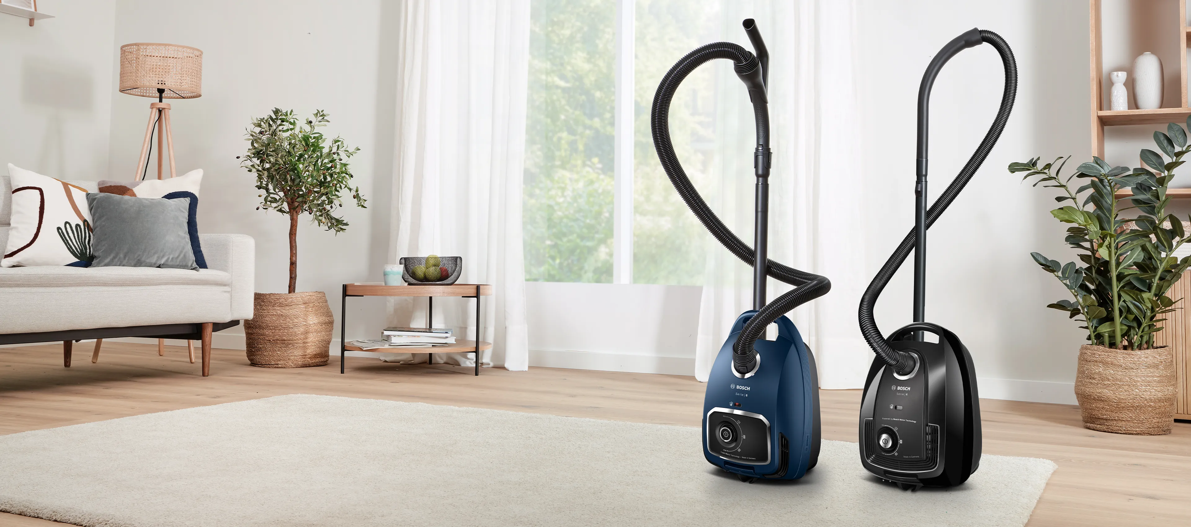 Bagged vacuum cleaners in a living room setting