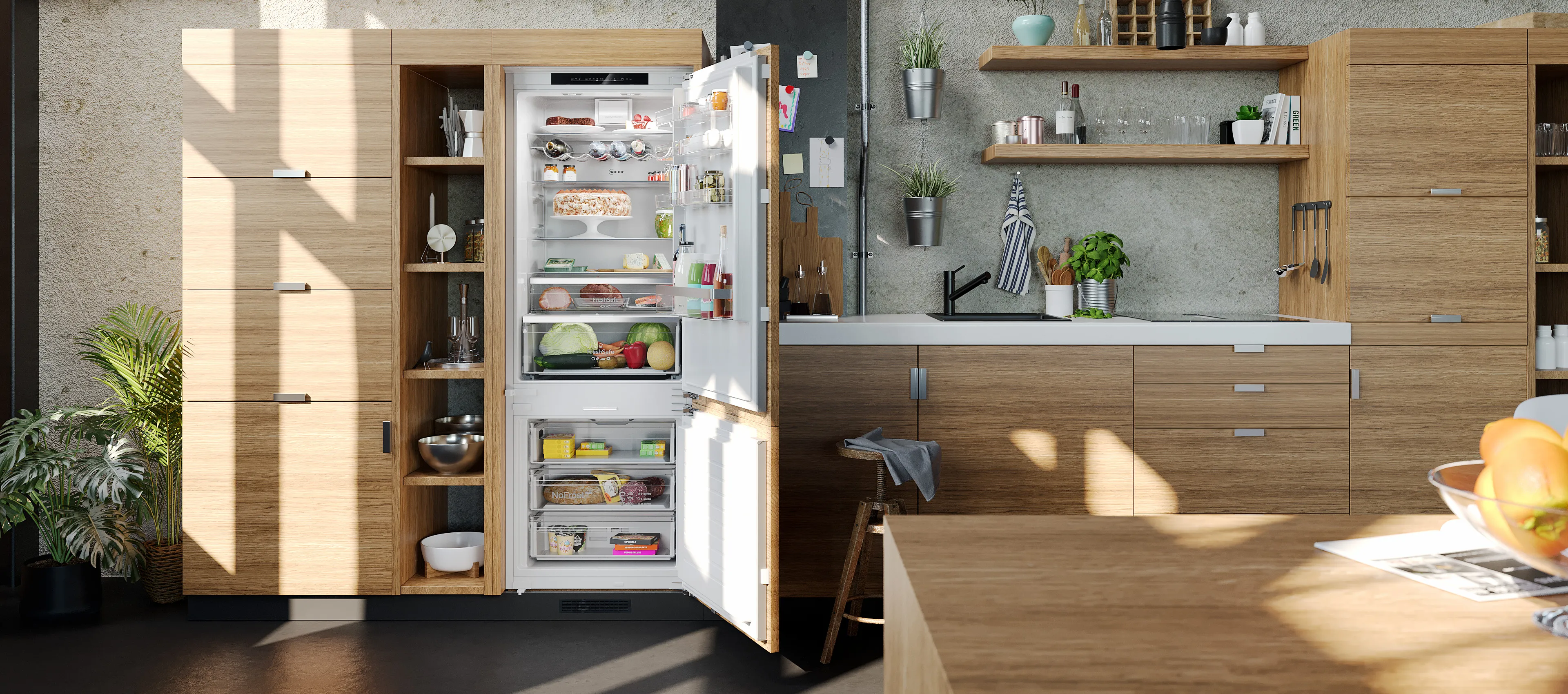 Modern kitchen with wooden cabinets, an open refrigerator filled with groceries, and sunlight streaming through large windows.
