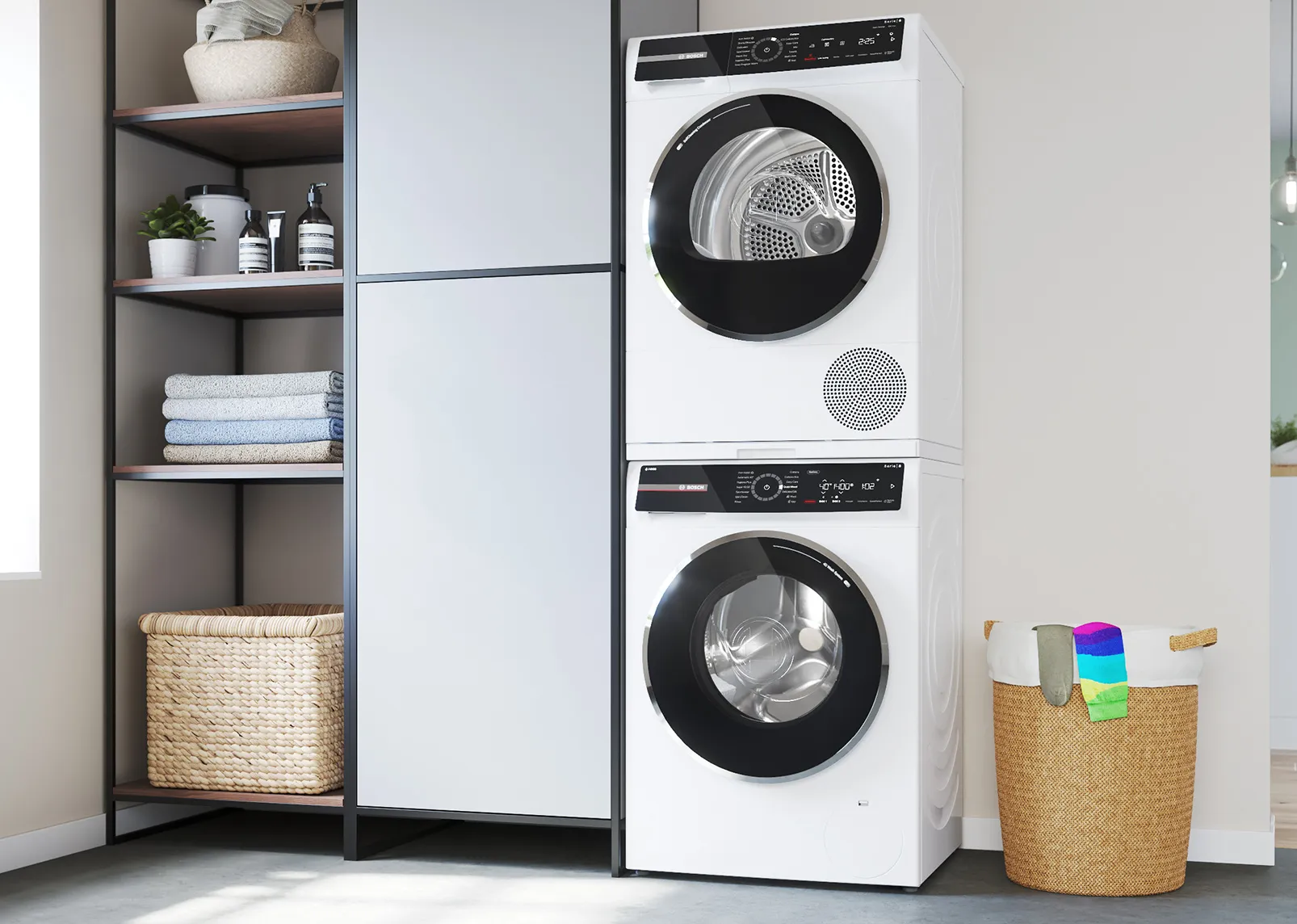 Stacked washer and dryer in modern laundry room with shelves, baskets, and decor.