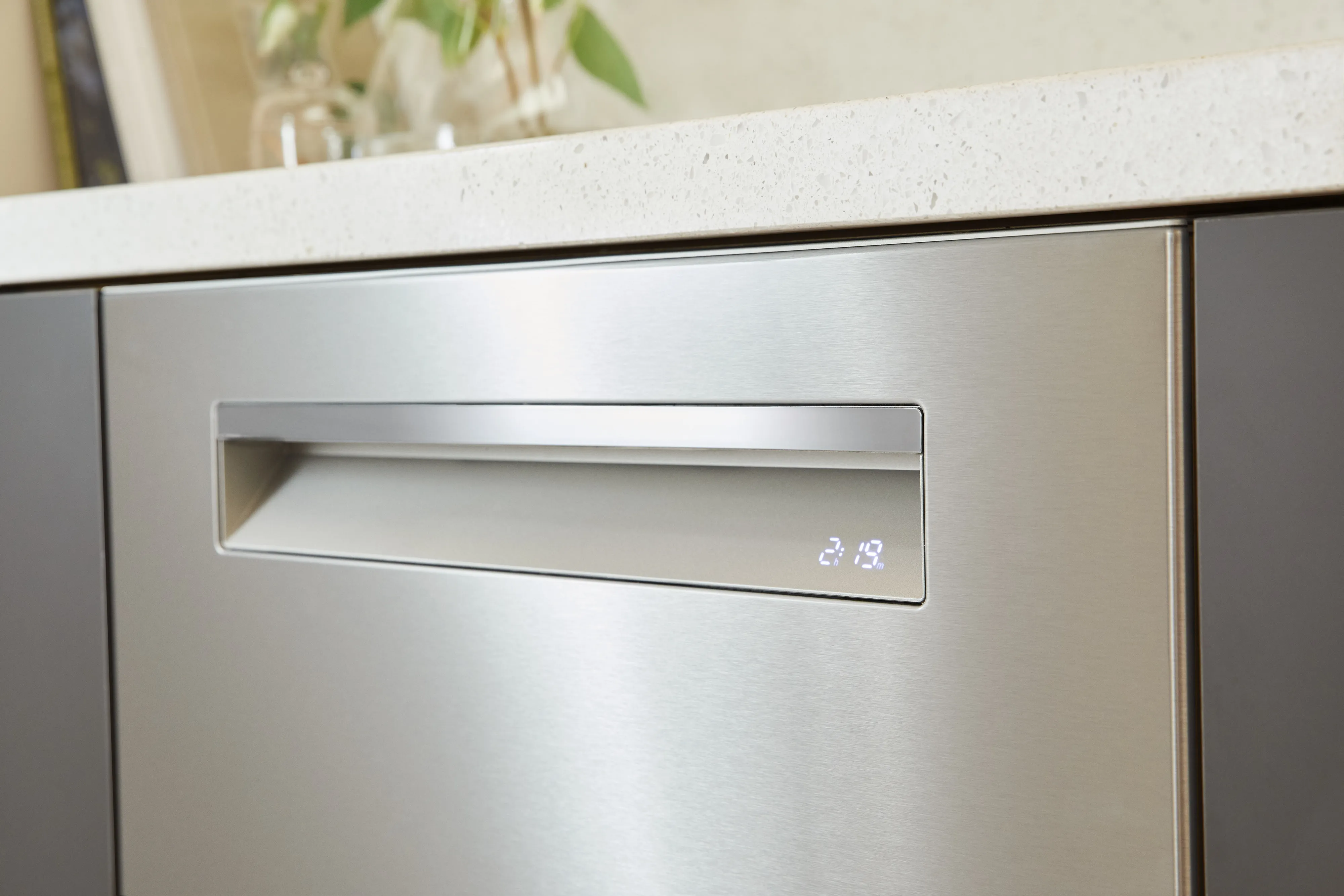 Bosch Stainless steel dishwasher with digital display integrated into modern kitchen cabinetry.