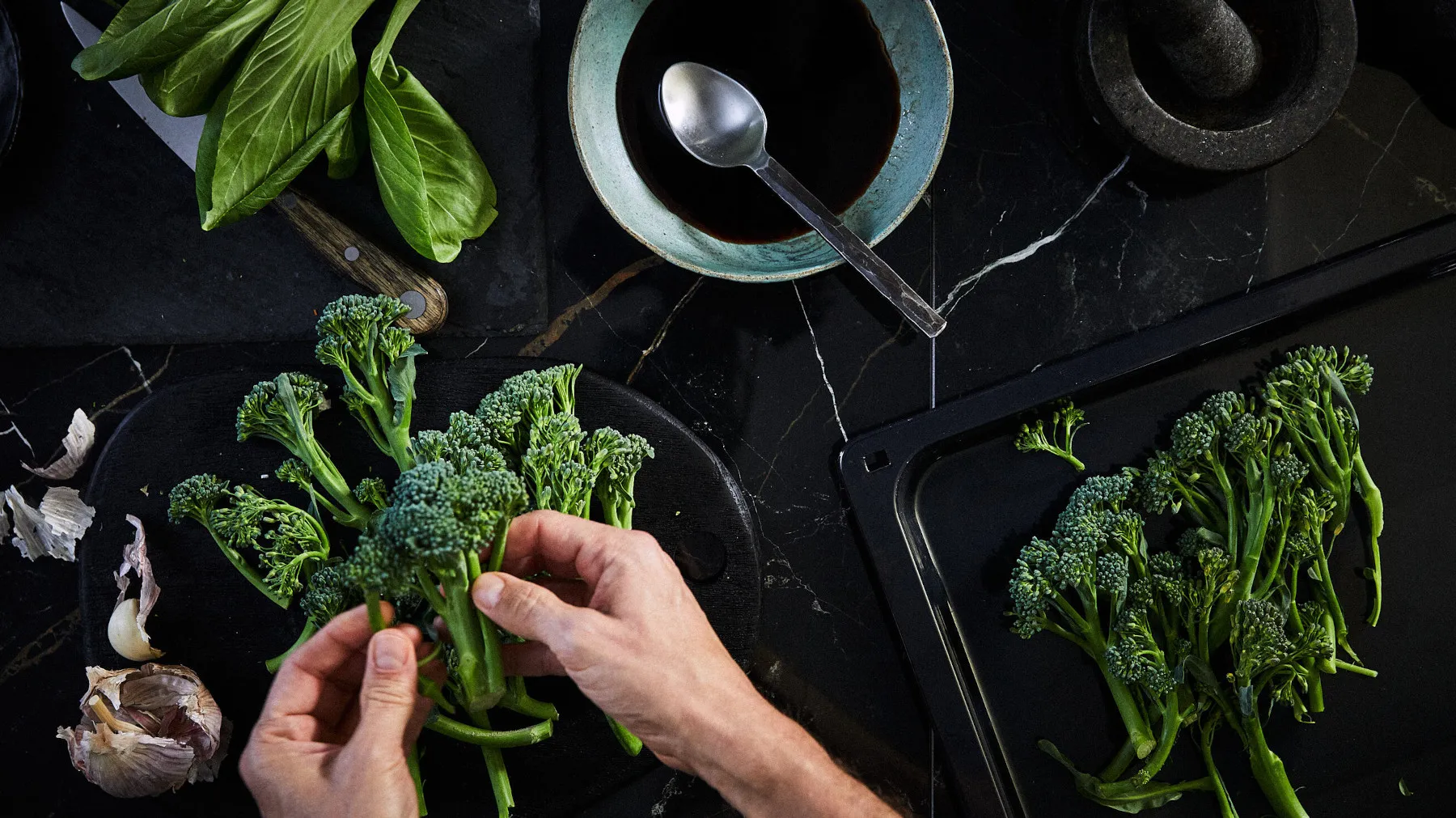 Person preparing broccoli