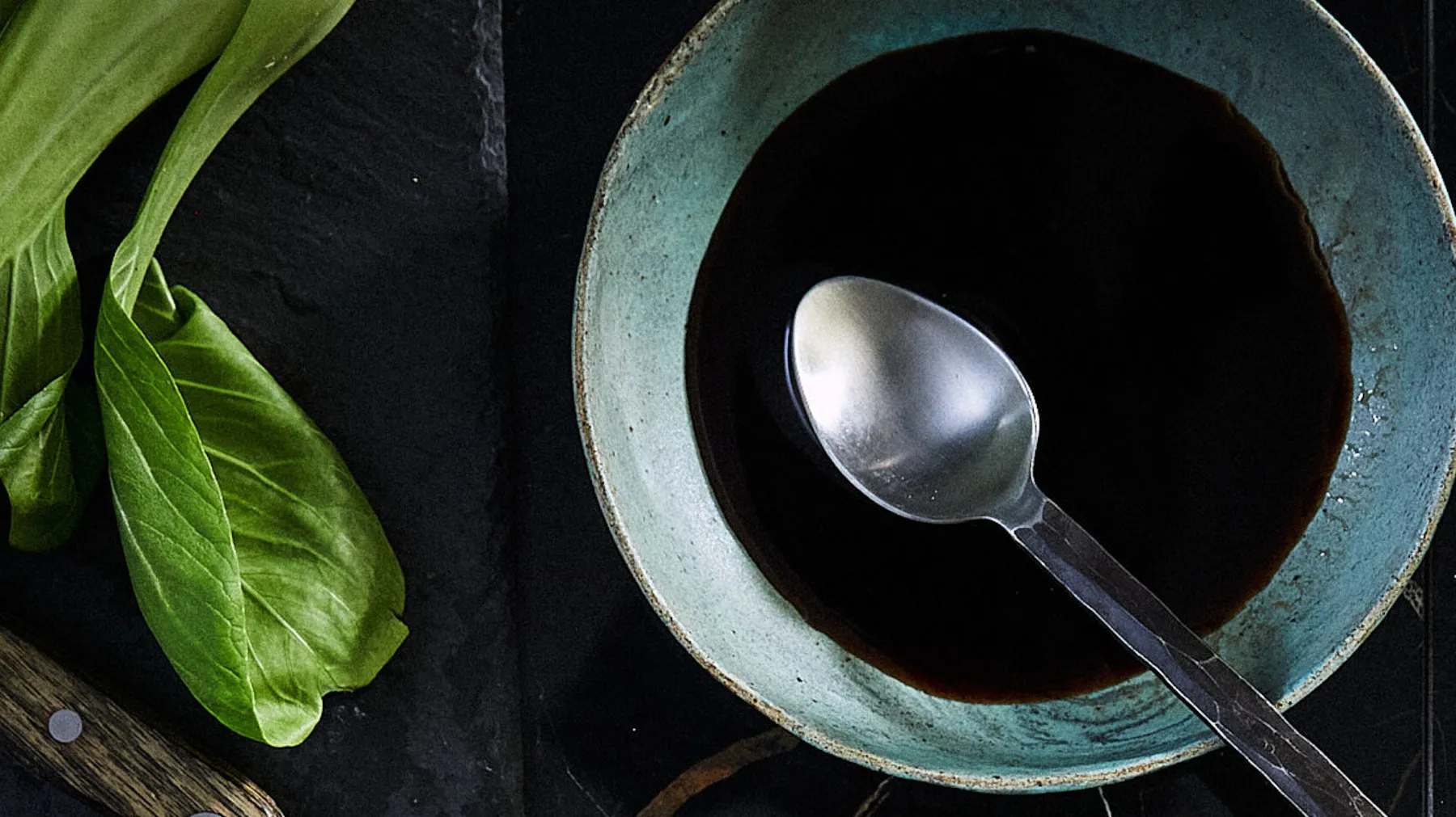 Bowl with sauce and spoon