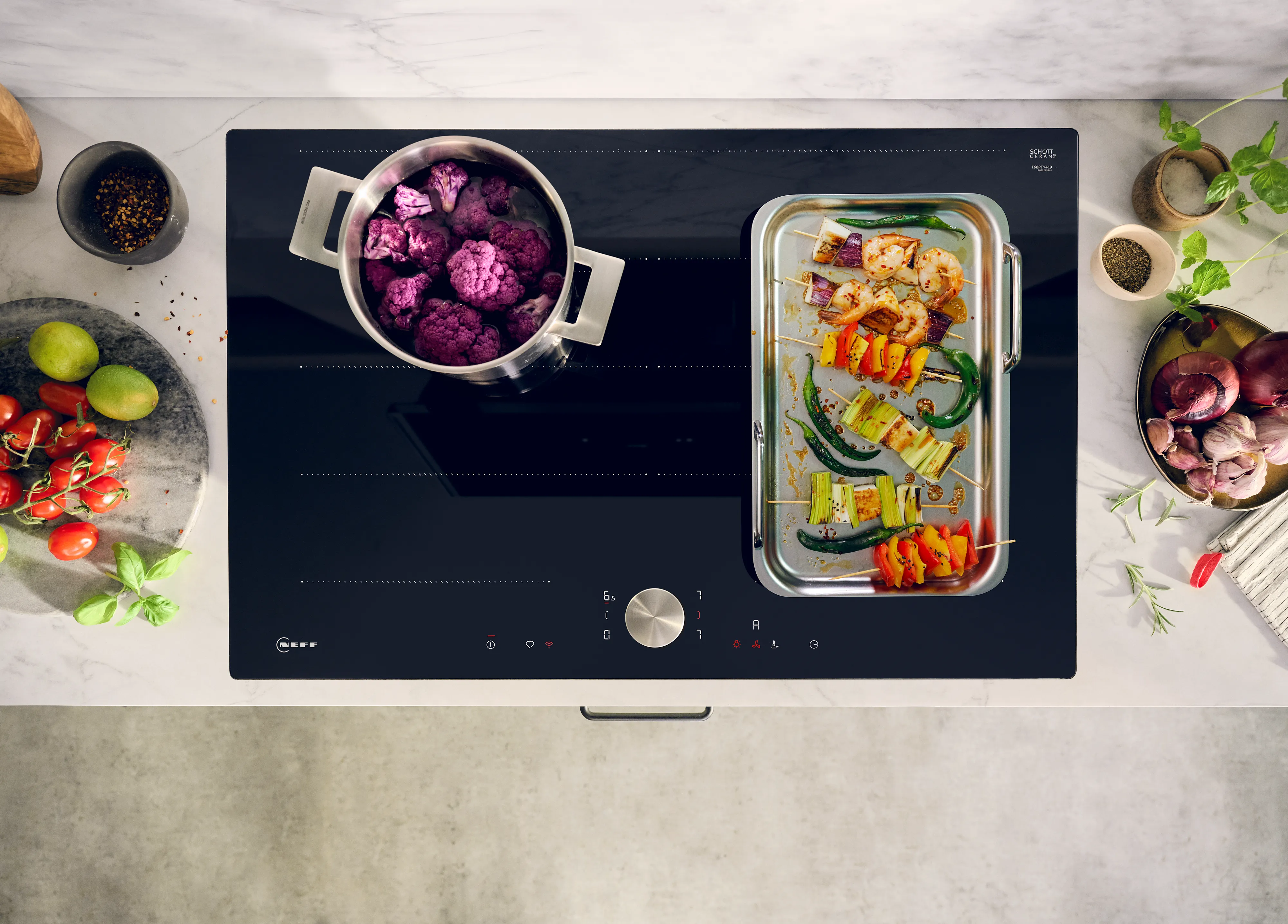 Induction hob with different sized pans in different cooking zones