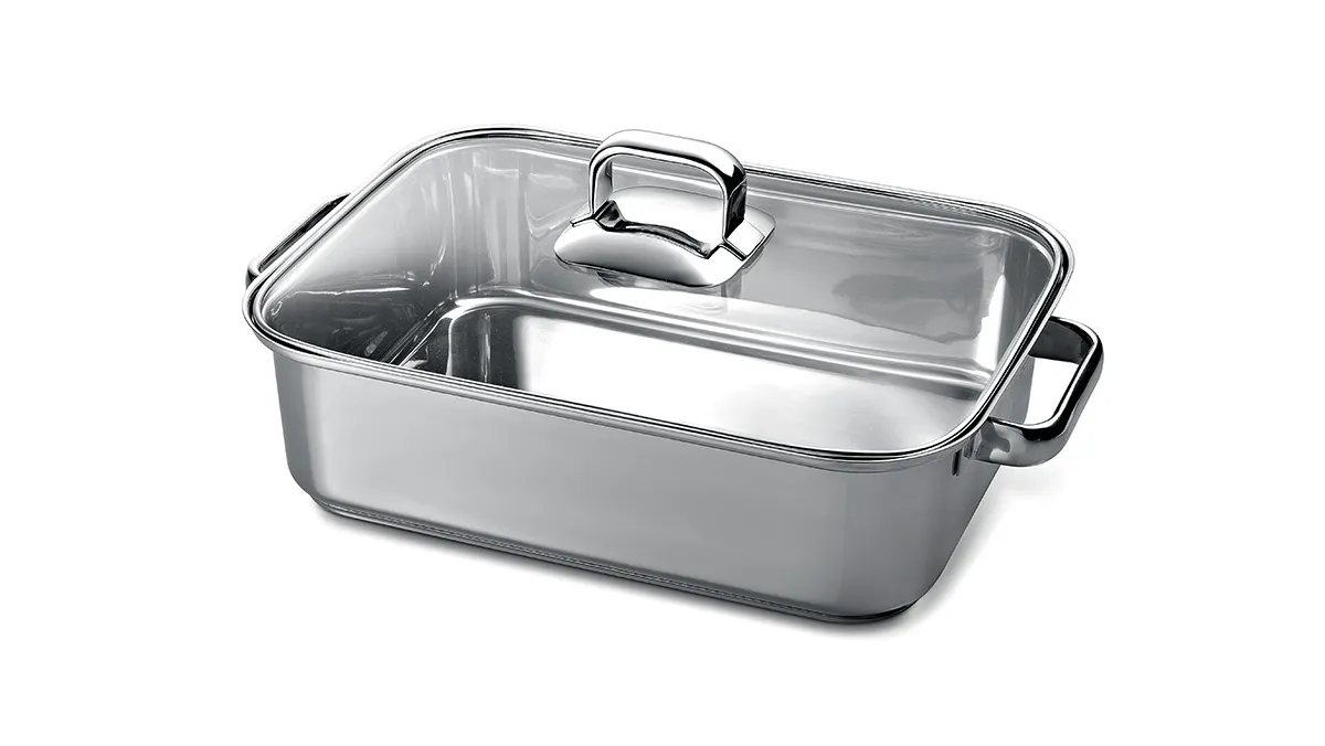 Stainless steel roasting pan with glass lid, rectangular shape, suitable for baking and roasting.