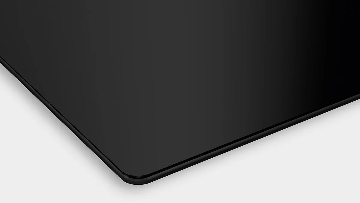 Black rectangular surface with sharp edges and smooth finish.