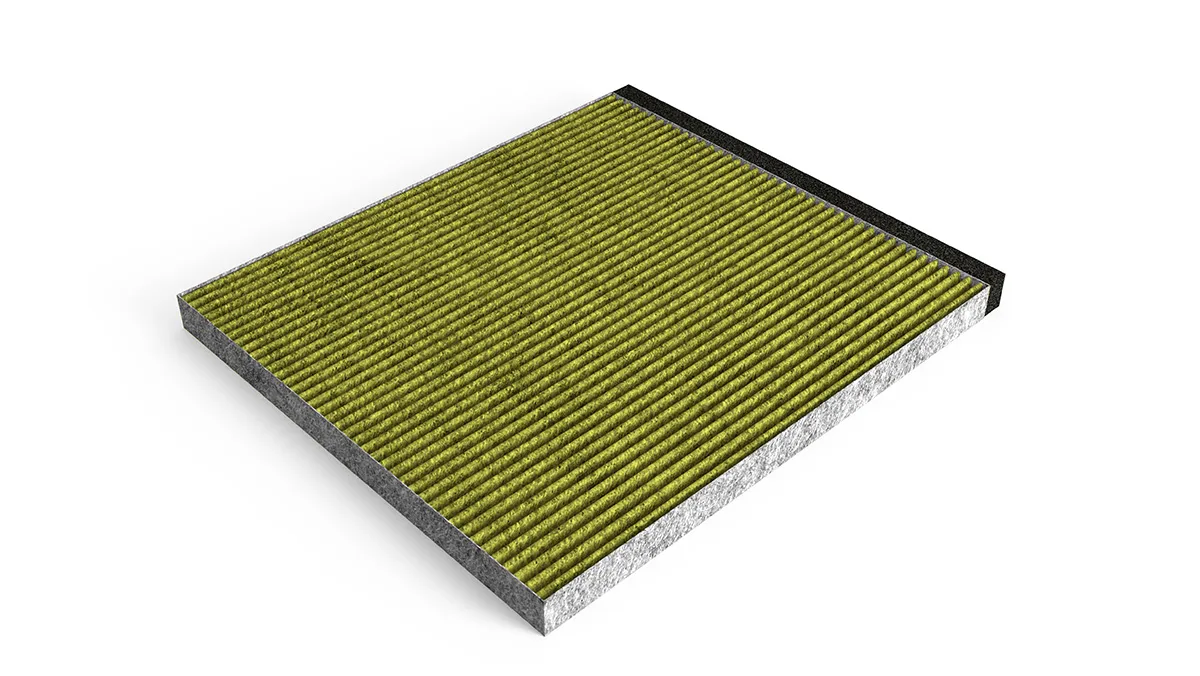 Rectangular green and gray textured surface, possibly a floor or mat.