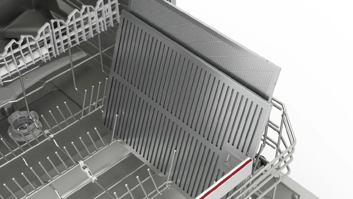 Dishwasher interior with metal racks and shelves, ready for loading dishes.