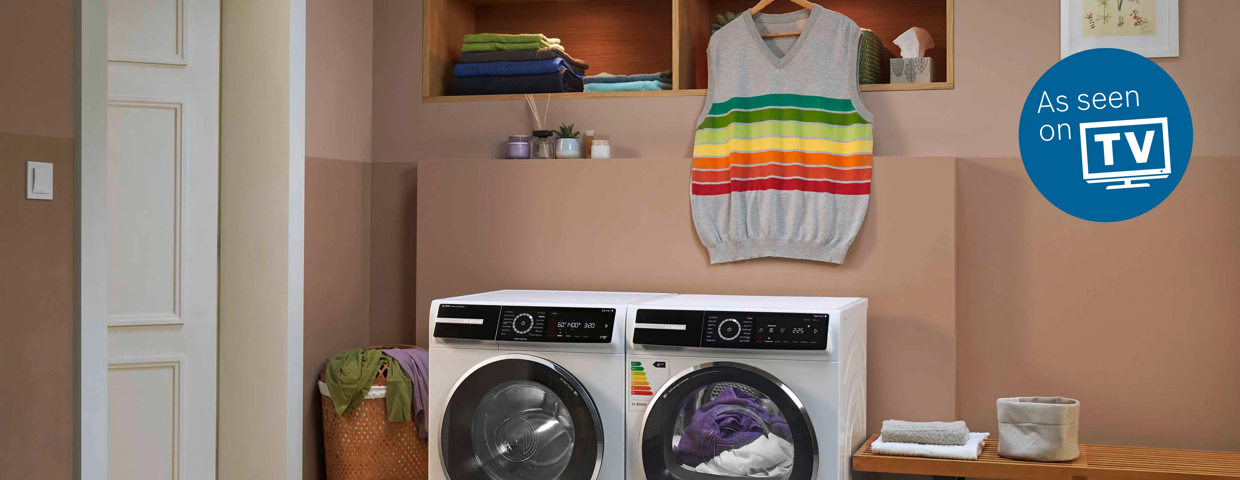 Bosch washer and dryer in a white laundry room.