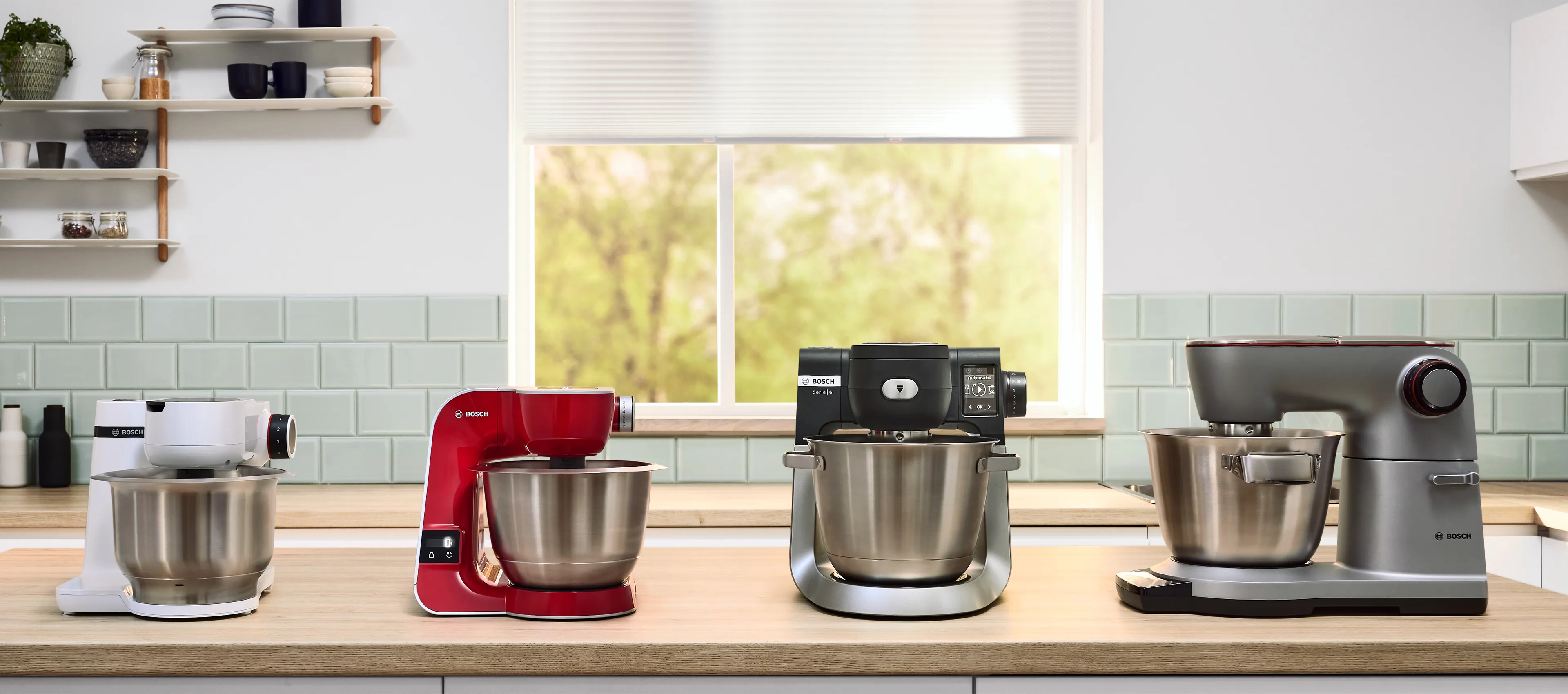 Line up of the three MUM stand mixers on a kitchen worktop.