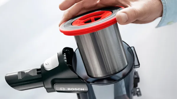 Person cleaning the dust container