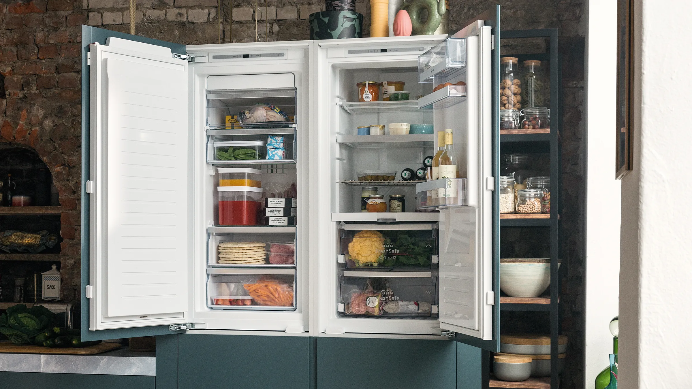 Open refrigerator filled with various food items, kitchen shelves, and cooking utensils.
