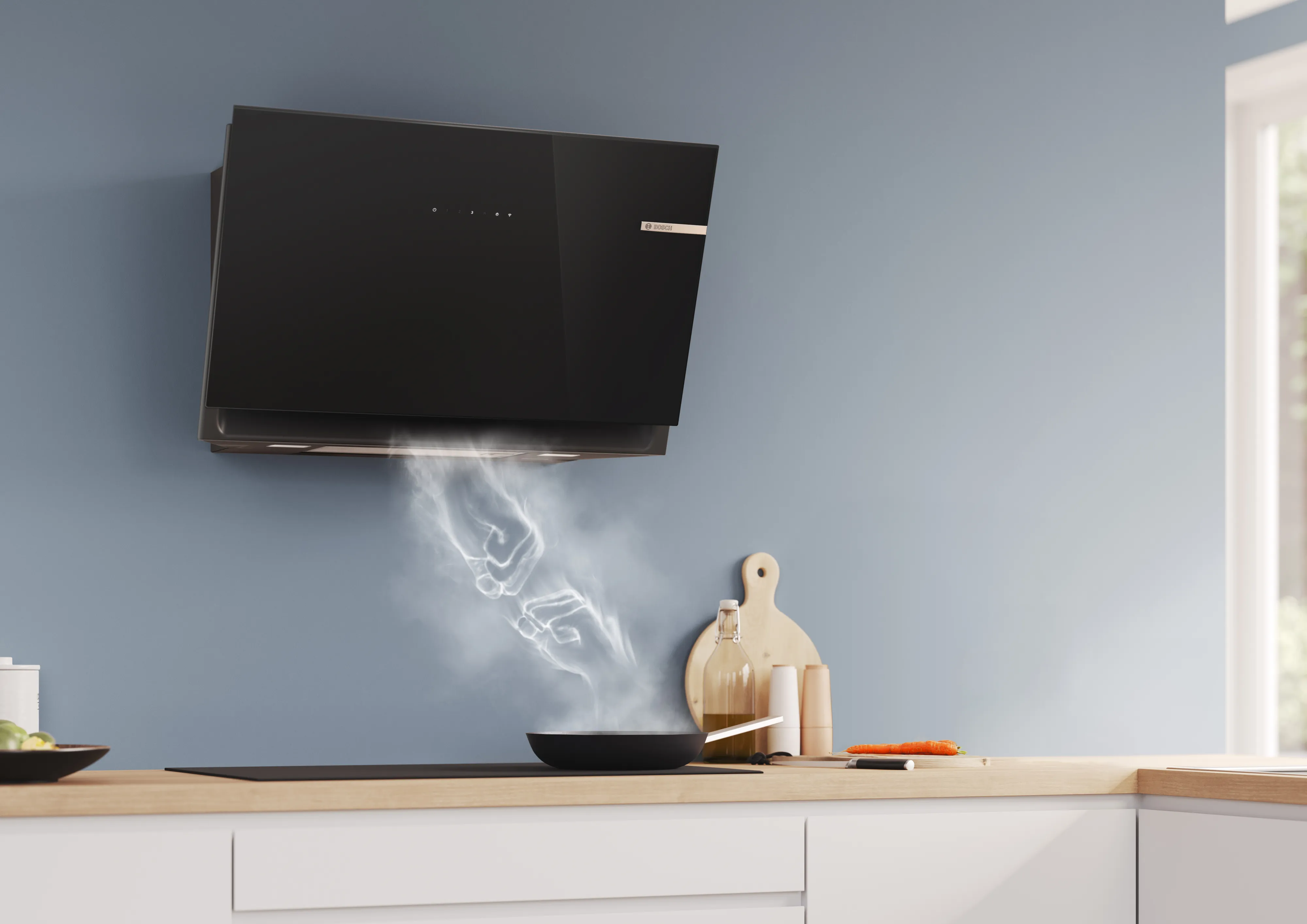 Bosch ventilator koblet til platetoppen, trekker opp damp som danner to knyttnevar som møtes i midten.